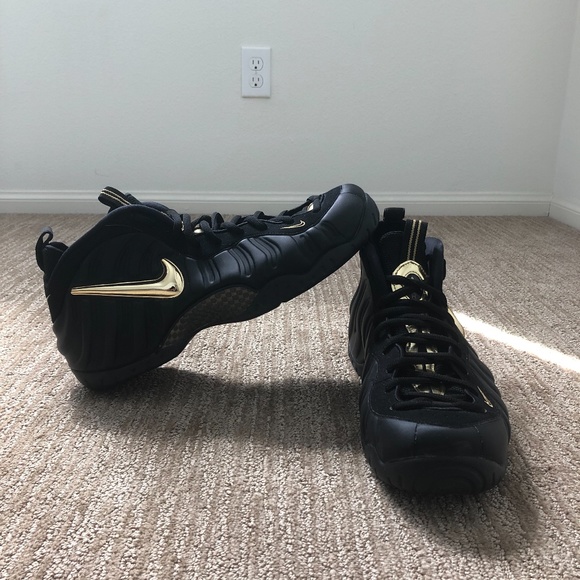 black and gold foamposite size 14